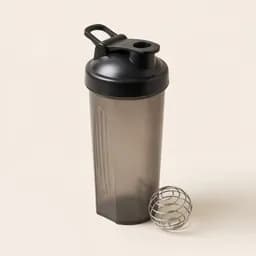 A protein shaker bottle with a whisk ball