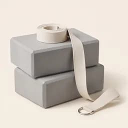 Two foam yoga blocks with a strap