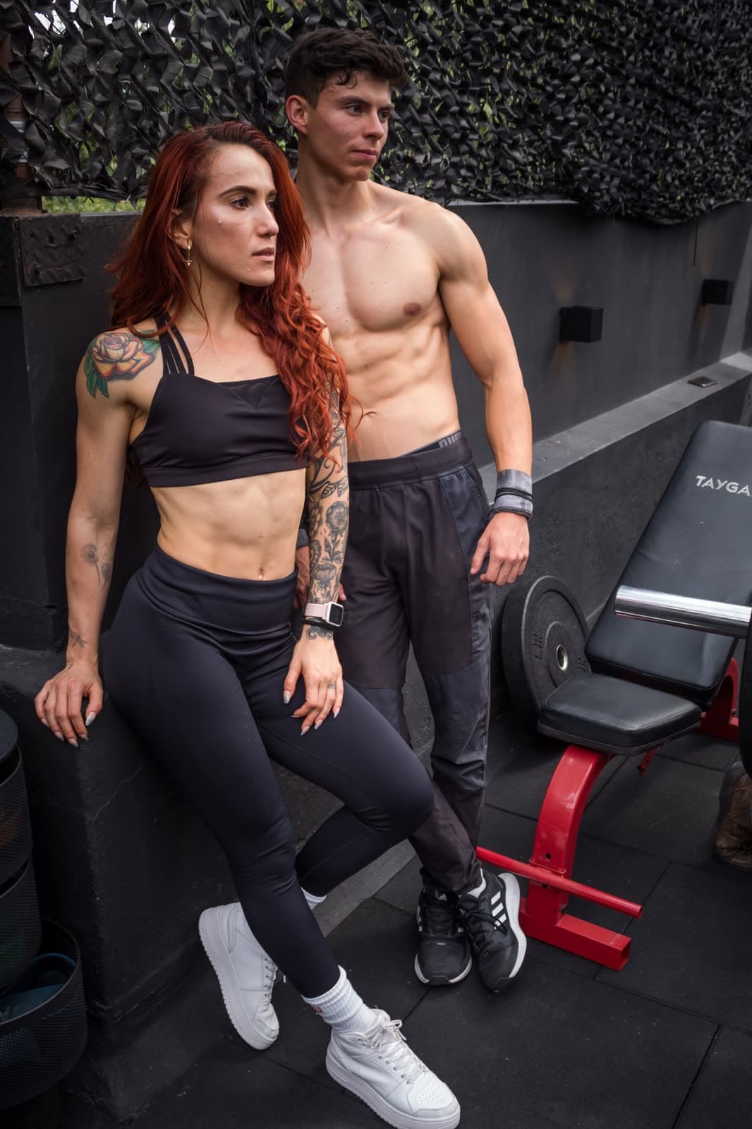 A fit, muscular man and woman in the gym